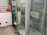 an image of a refrigerator in a store with a glass door