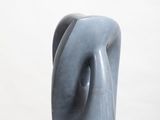 a blue sculpture on a white pedestal with a white background
