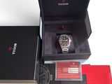 a box with a watch inside of it on a table