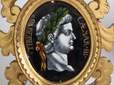 a gold frame with a picture of a man with a wreath on it