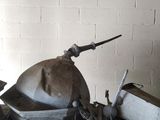 a pile of tools sitting on a table in a room