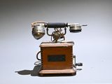 an old fashioned telephone that is sitting on a table