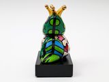 sculpture of a frog with a crown on its head on a black base