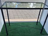 a glass table in the corner of the room