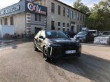 a car parked in front of a building on the street