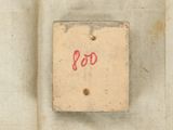 a close up of a piece of cloth with a small piece of writing on it