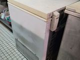 an image of a kitchen with a refrigerator and other appliances