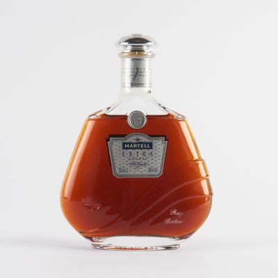 an image of a bottle of brandy sitting on top of a table