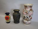 three vases sitting next to each other on a table
