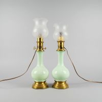 Deux lampes à pétrole en céramique émaillée couleur vert cél…