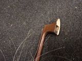 a small axe that is laying on the ground