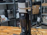 a vacuum that is sitting on a table in a room