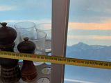a measuring tape on a window sill next to a window