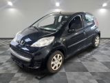 a picture of a small black car on a checkered floor