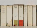 a lot of books that are on a shelf