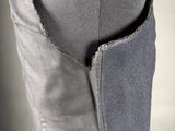 the back of a woman ' s pants with a pocket on the side