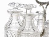 several glass vases and a mirror on a table