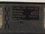 a small black box that has a button on it