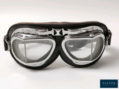 a pair of goggles sitting on top of a white surface