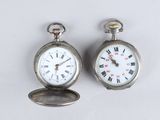 two silver pocket watches with roman numerals and roman numerals on them