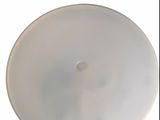 a white plate with a hole in the middle of it