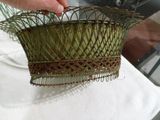 a person that is holding a basket on a table