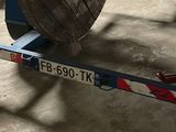 a car that is sitting on a dolly in a garage