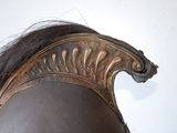 a close up of a head of a person with a helmet on