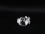a close up of a diamond on a black surface