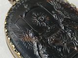 a black and gold locke with a picture on it