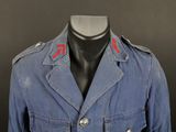 an image of a blue military jacket on a mannequin