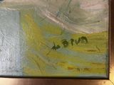 a picture of a painting on a table with a clock on it