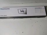 a box that is sitting on the floor next to the wall