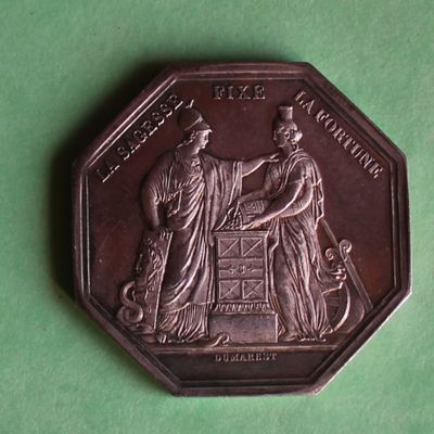 a coin with a picture of a man and woman on it