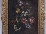 painting of flowers in a gold frame on a white background