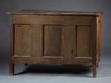 an old wooden chest sitting on top of a gray floor