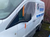 a white van that has been covered with a tarp