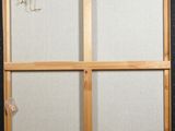 a close up of a picture of a window with a string hanging from it