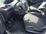 the interior of a car with a steering wheel and a dashboard