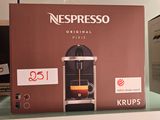 a coffee machine on the shelf in the store