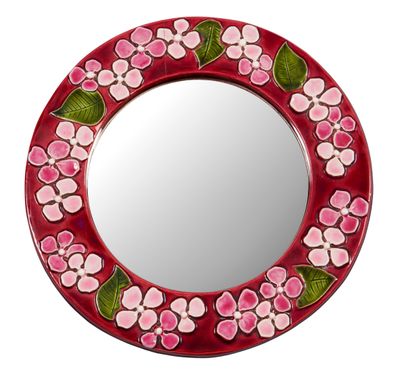 miroir avec un cadre rouge orné de fleurs roses et de feuilles vertes