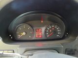 a close up of a car dashboard with a speedometer and gauges