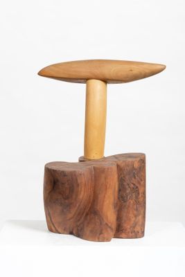 an image of a wooden stool with a wooden top on a white surface