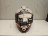 an image of a helmet on a table with a tag on it