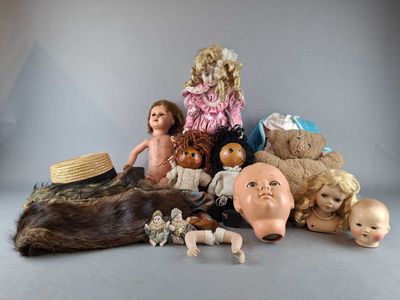 a lot of dolls that are sitting on a table