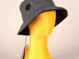 a close up of a mannequin head with a hat on it