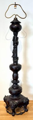 a lamp that is on top of a wooden table
