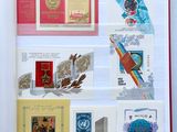 a book with stamps on the pages and a picture of a space shuttle
