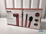the box is open to show the contents of a hair dryer