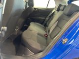 the back seats of a blue car with a black seat belt